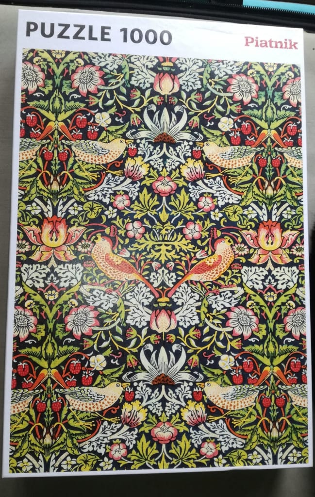 William Morris Strawberry Thief pattern with birds, flowers, and strawberries on a dark background.