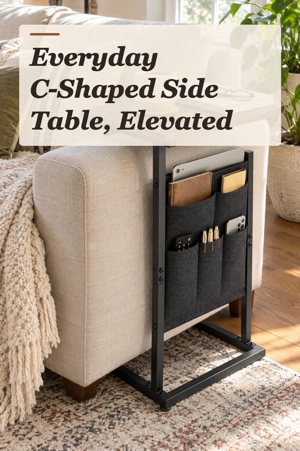 A c-shaped side table used in a comfortable apartment living room with natural window light and practical everyday styling.