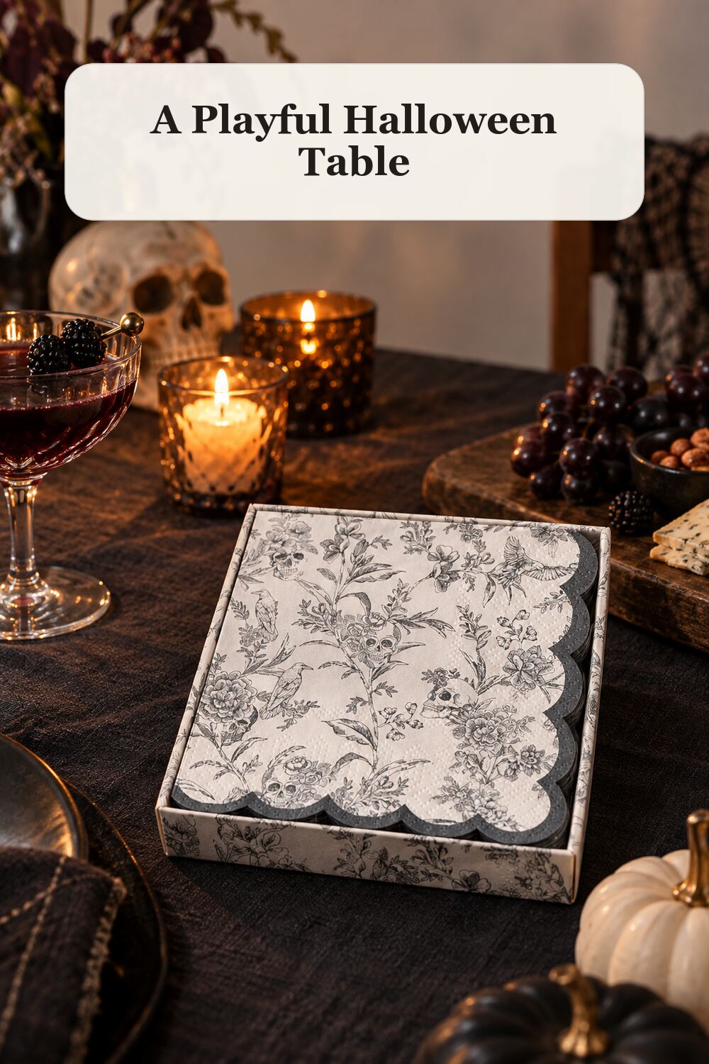 40pk Scalloped Edge Skull Cocktail Napkins styled in a warm, realistic halloween home setting.