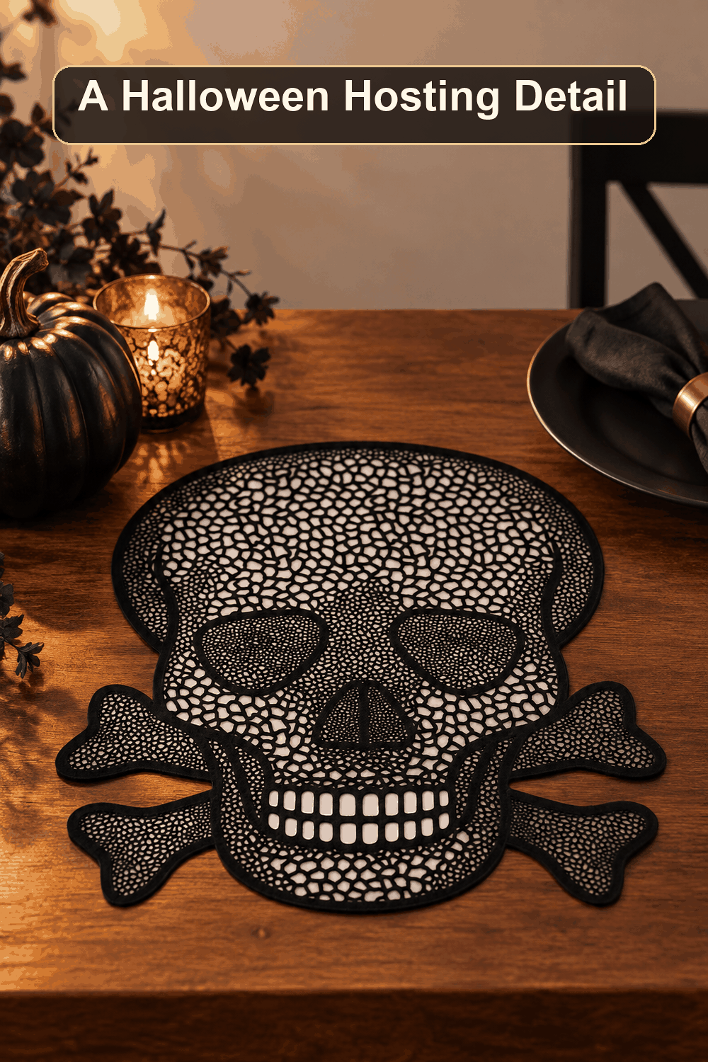 Styled Halloween home scene featuring the Skull Placemat, 15", with the words A Halloween Hosting Detail in a dark banner above.