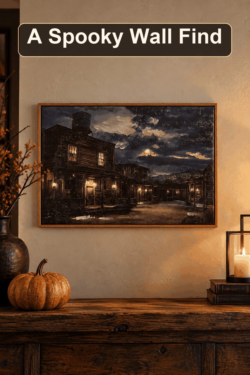 Styled Halloween home scene featuring the Ghost Town Canvas Wall Decor, 14x20, with the words A Spooky Wall Find in a dark banner above.