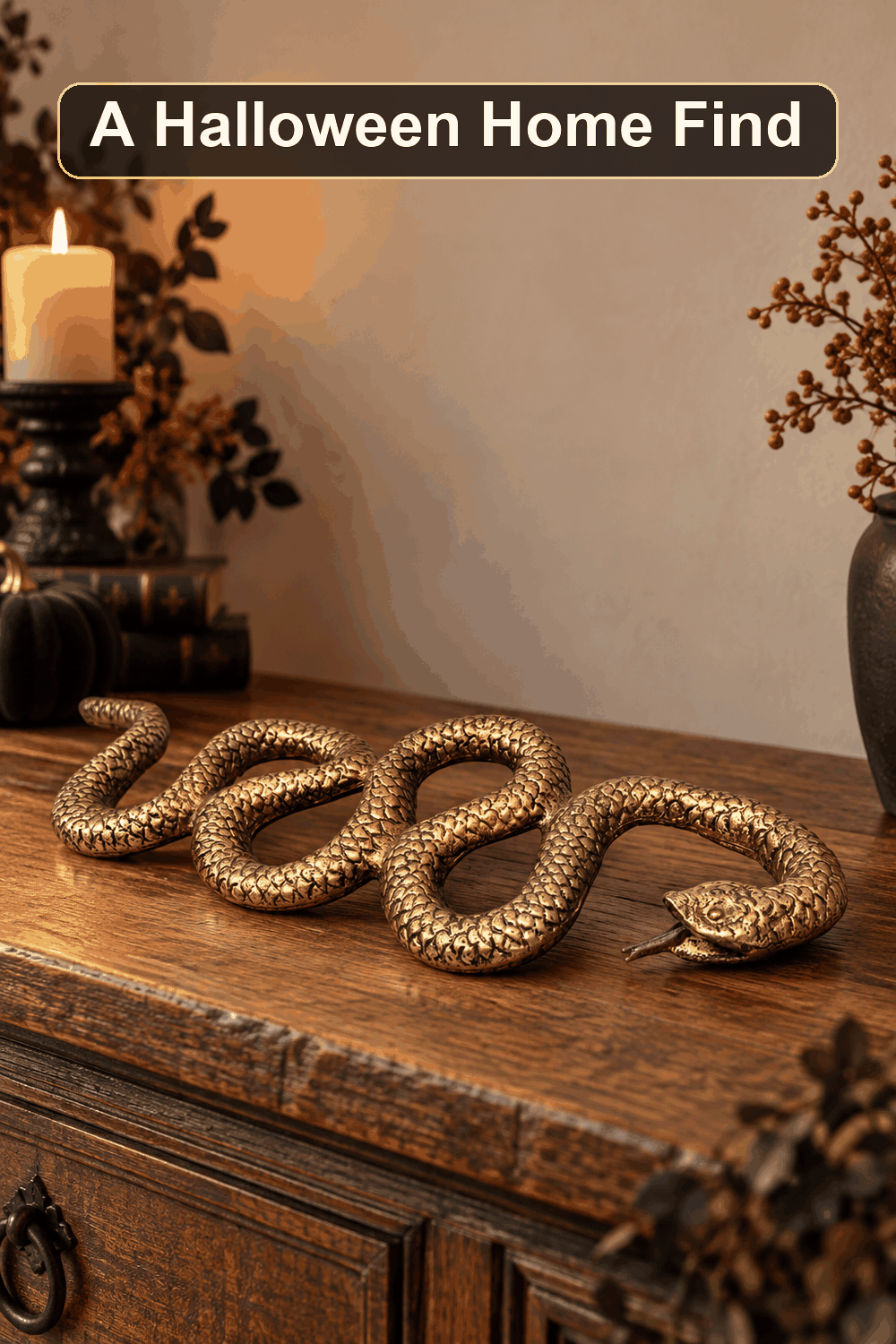 Styled Halloween home scene featuring the Metal Gold Snake, 20", with the words A Halloween Home Find in a dark banner above.