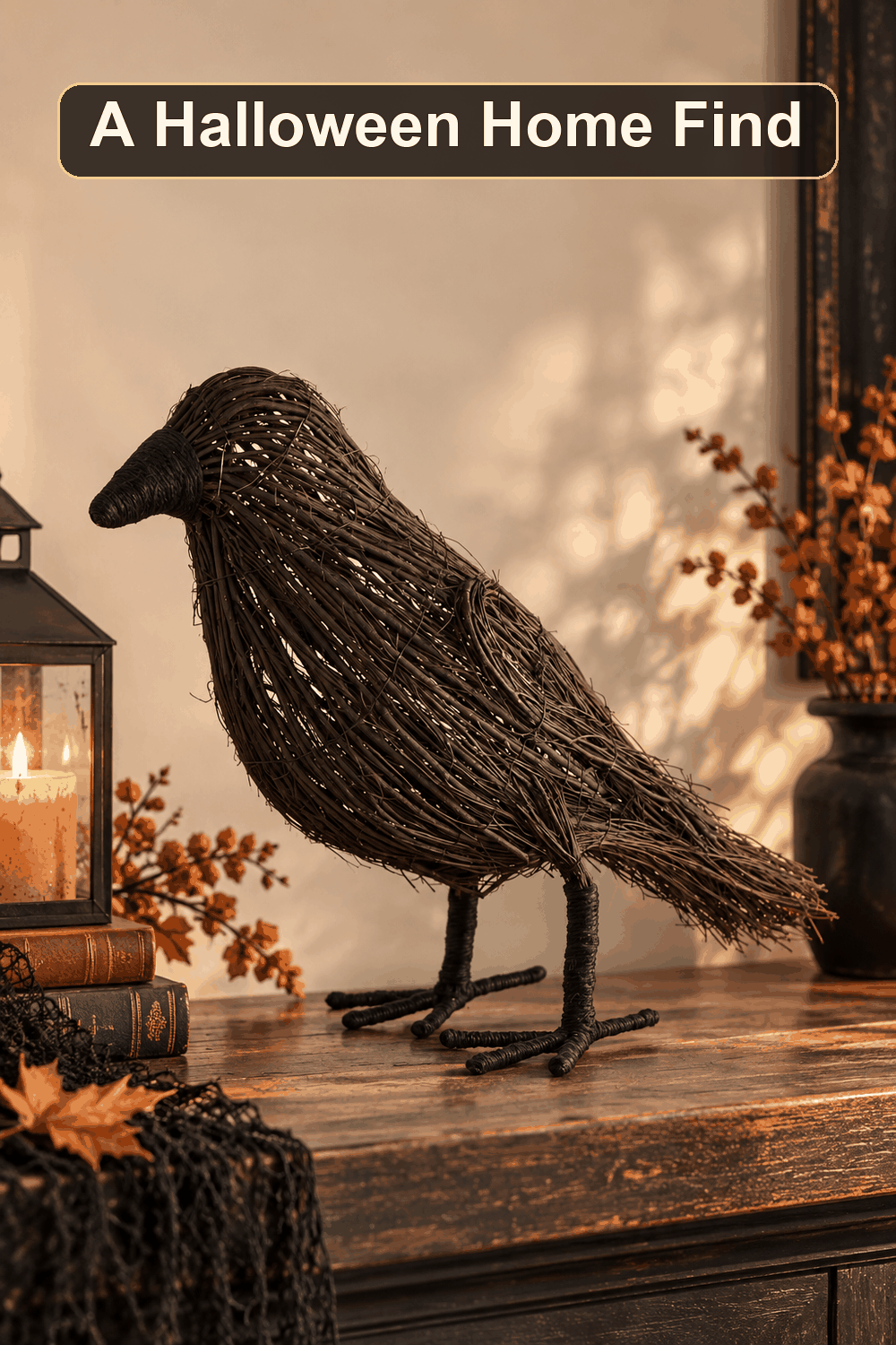 Styled Halloween home scene featuring the Rattan Black Crow, 22", with the words A Halloween Home Find in a dark banner above.