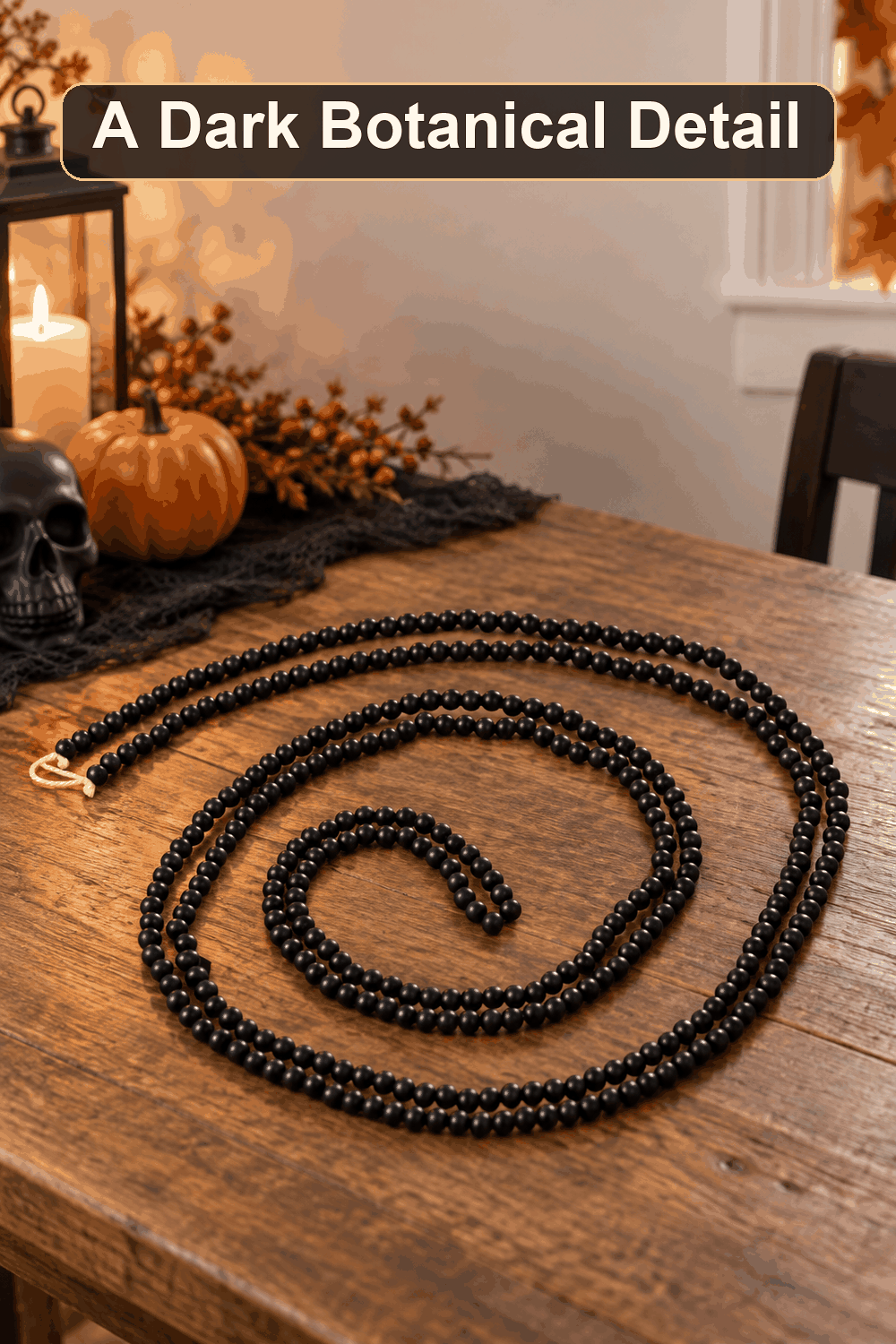 Styled Halloween home scene featuring the Black Wooden Beaded Garland, 12', with the words A Dark Botanical Detail in a dark banner above.