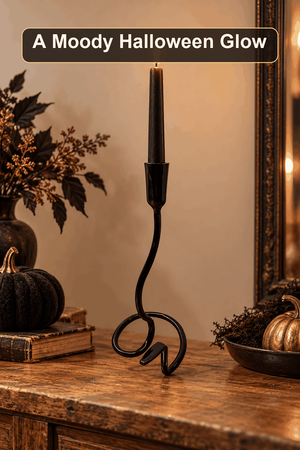 Styled Halloween home scene featuring the Gold Metal Snake Tail Candle Holder, 12", with the words A Moody Halloween Glow in a dark banner above.