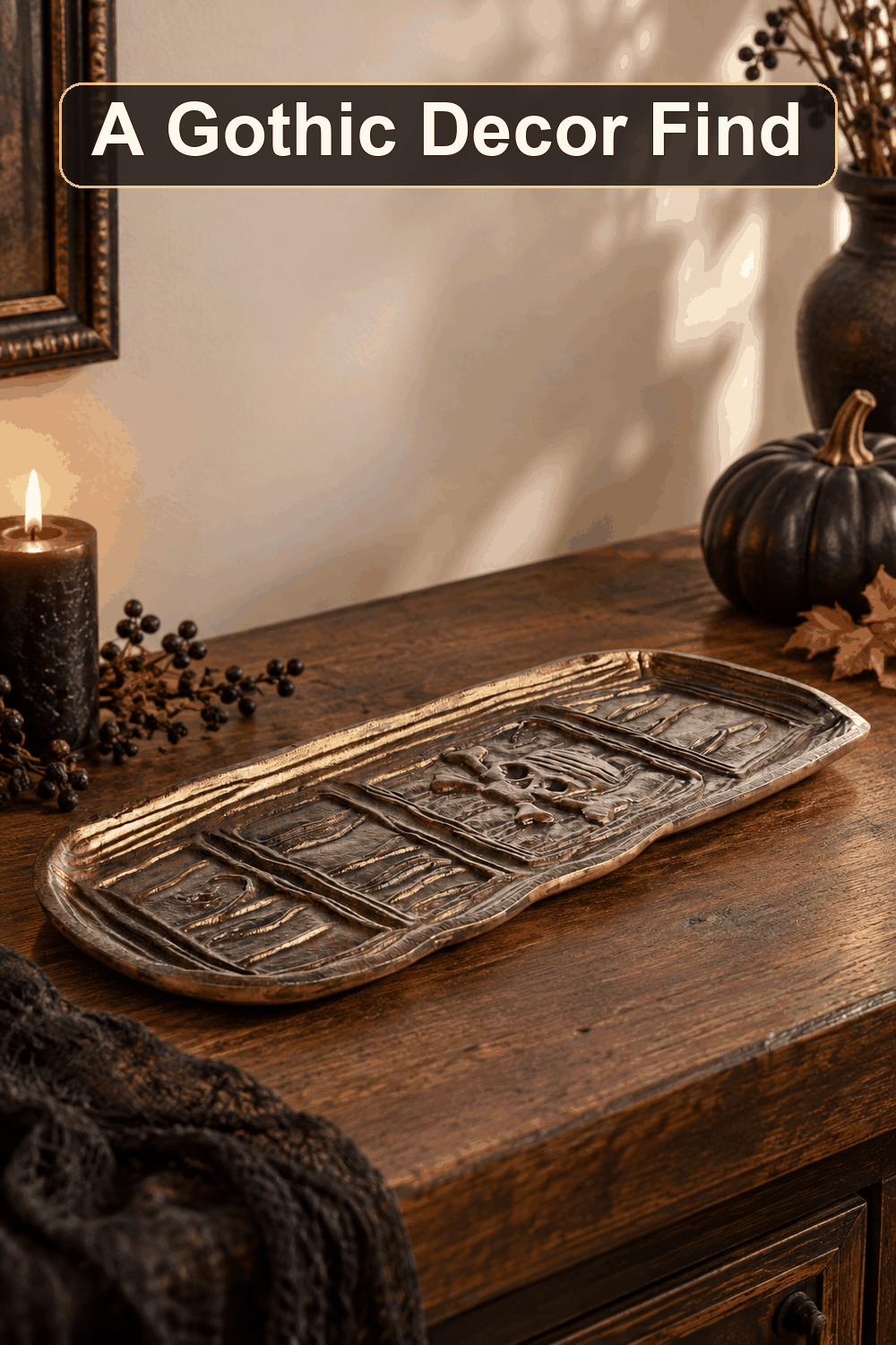 Styled Halloween home scene featuring the Antique Gold Skull Tray, 13.5", with the words A Gothic Decor Find in a dark banner above.
