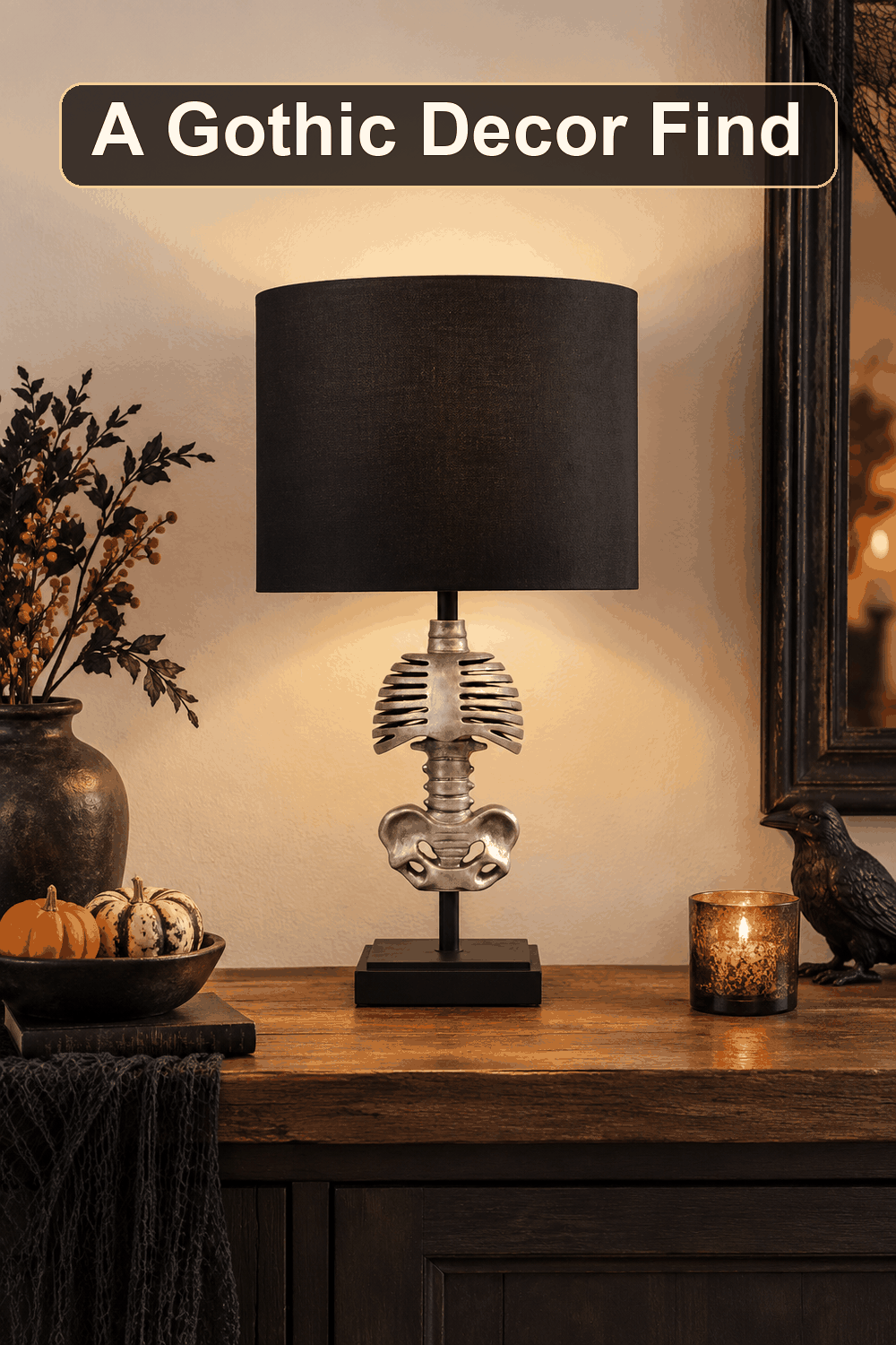 Styled Halloween home scene featuring the Black Skeleton Table Lamp with Shade, 24", with the words A Gothic Decor Find in a dark banner above.