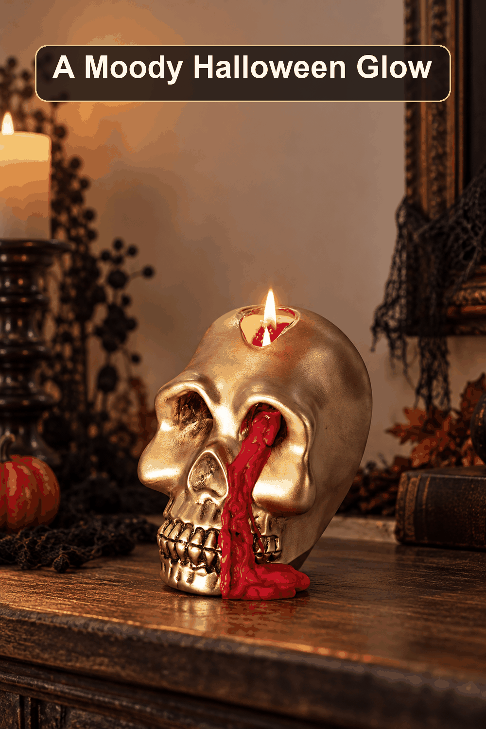 Styled Halloween home scene featuring the Medium Gold Skull Bleeder Candle, 4.3", with the words A Moody Halloween Glow in a dark banner above.