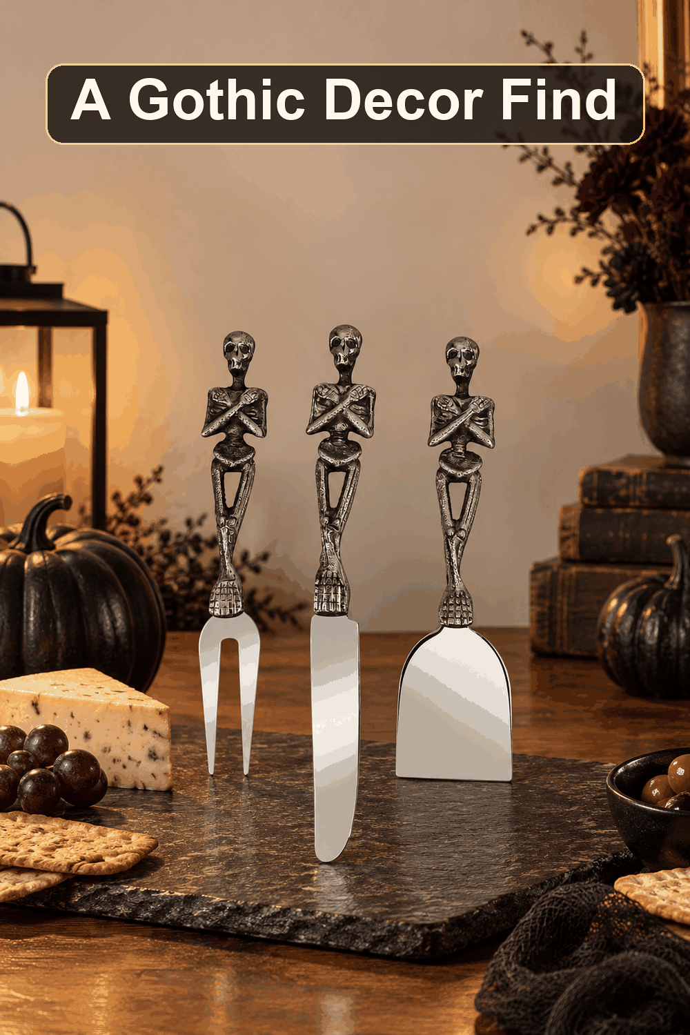 Styled Halloween home scene featuring the Set of 3 Skeleton Cheese Knives, with the words A Gothic Decor Find in a dark banner above.