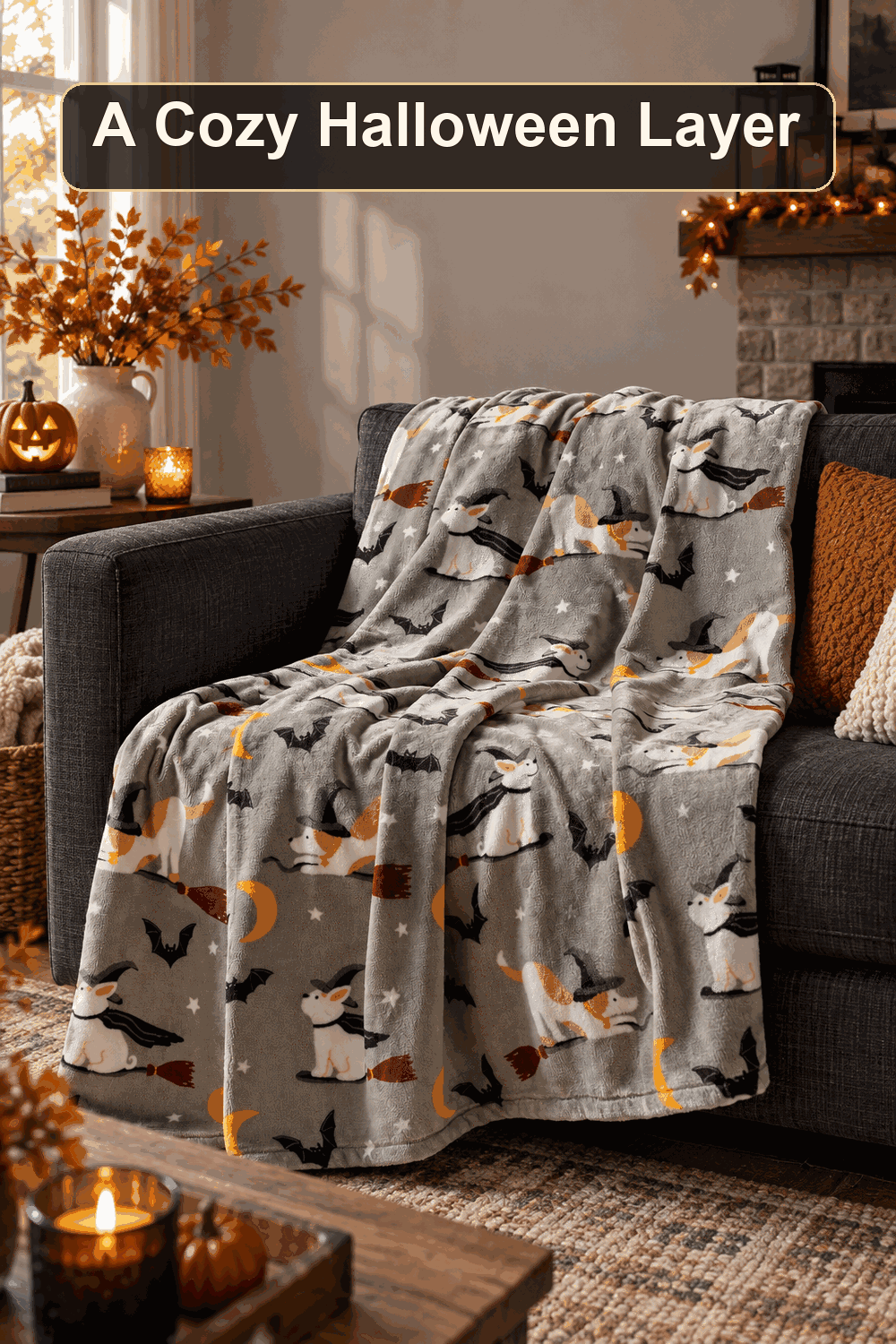 Styled Halloween home scene featuring the Member's Mark Halloween Lounge Throw, 60" x 70", with the words A Cozy Halloween Layer in a dark banner above.