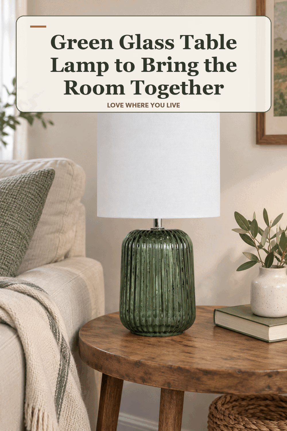 A realistic lived-in home scene featuring the exact Mainstays Green Glass Table Lamp, beneath the words Green Glass Table Lamp to Bring the Room Together.