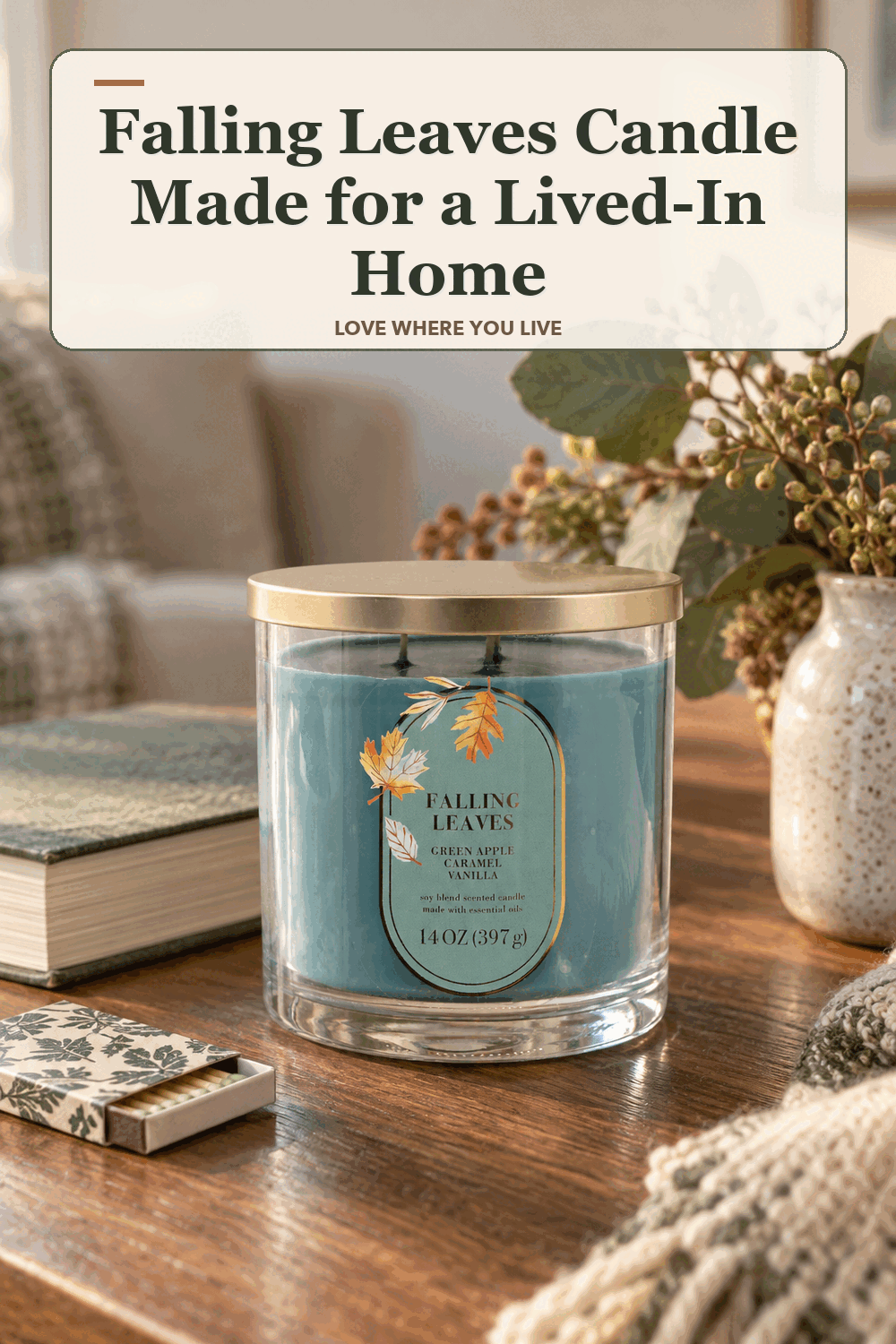 A realistic lived-in home scene featuring the exact Sonoma Goods for Life Falling Leaves Candle, beneath the words Falling Leaves Candle Made for a Lived-In Home.