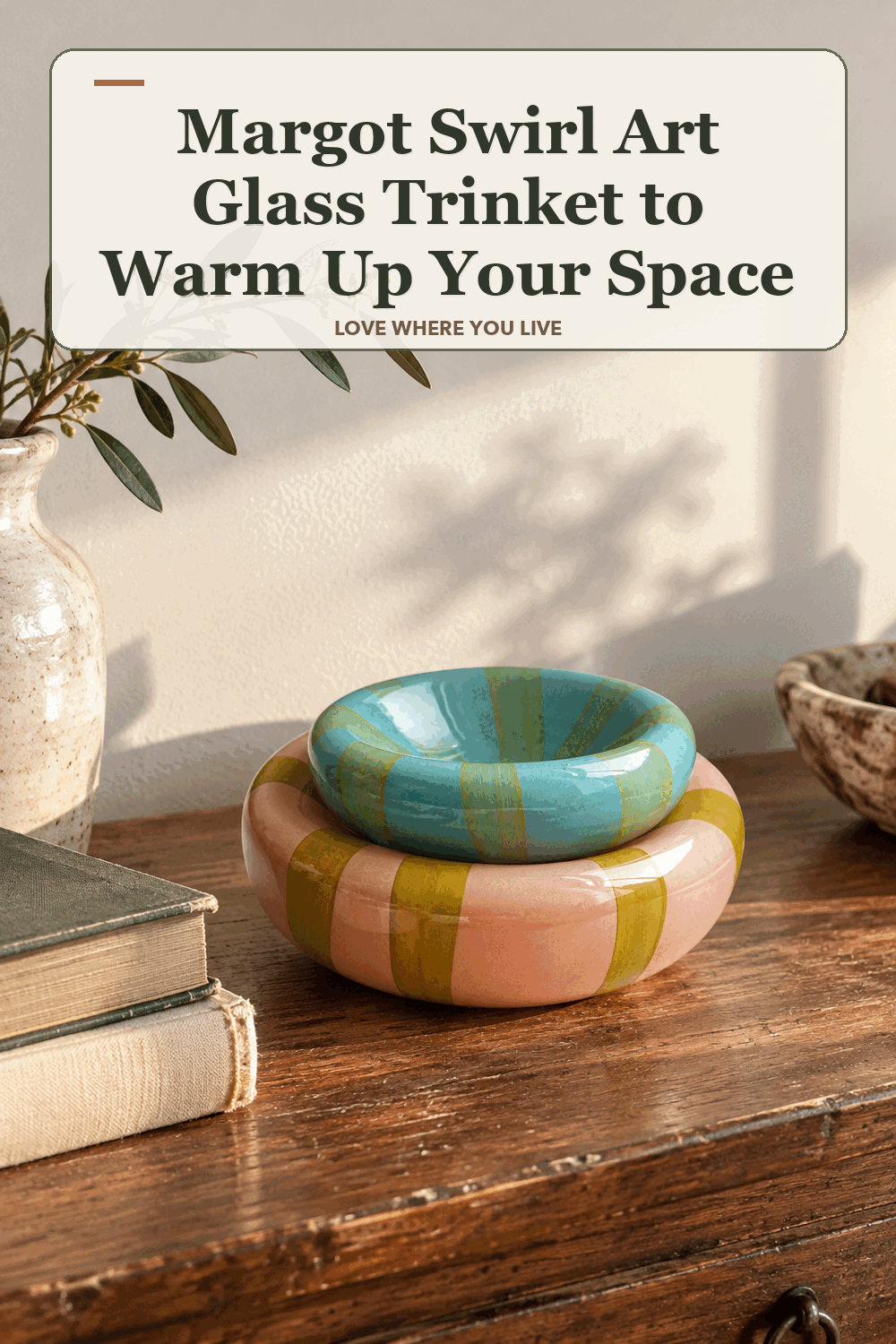 A realistic lived-in home scene featuring the exact Margot Swirl Art Glass Trinket, beneath the words Margot Swirl Art Glass Trinket to Warm Up Your Space.