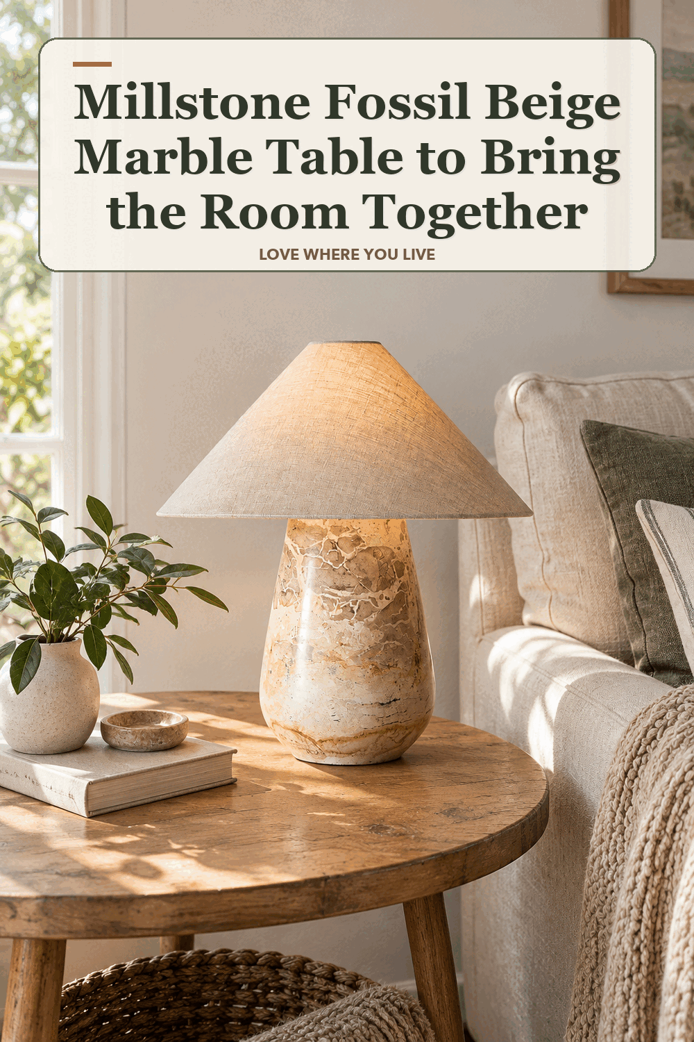 A realistic lived-in home scene featuring the exact Millstone Fossil Beige Marble Table Lamp, beneath the words Millstone Fossil Beige Marble Table to Bring the Room Together.