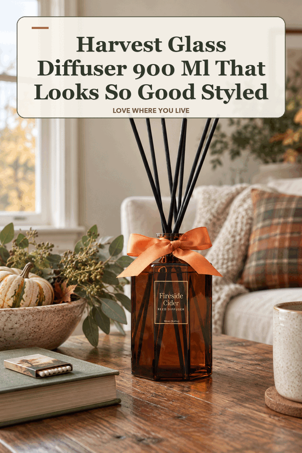 A realistic lived-in home scene featuring the exact Member's Mark Harvest Glass Diffuser 900 ml, beneath the words Harvest Glass Diffuser 900 Ml That Looks So Good Styled.