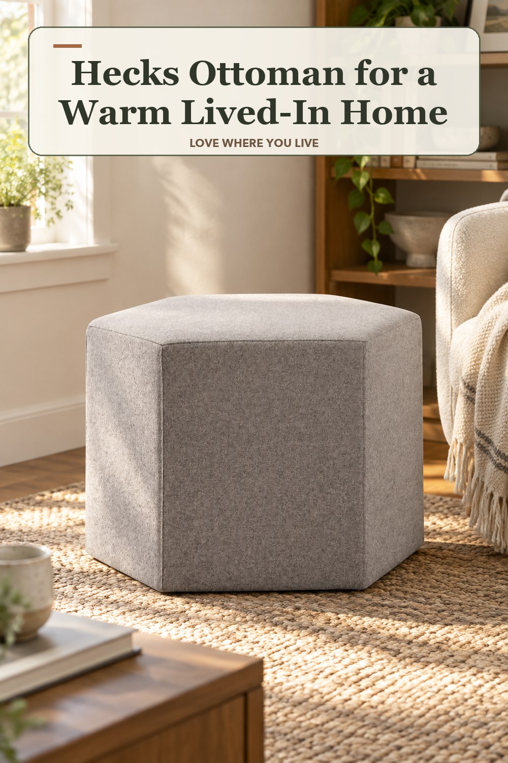 Warm natural-light apartment scene featuring the exact Hecks Ottoman in Vesper Light Grey, with the headline: Hecks Ottoman for a Warm Lived-In Home.