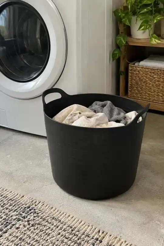 Mainstays Flexible Round Laundry Hamper with Carry Handles, Black Plastic, 2.2 Bushels; styling illustration