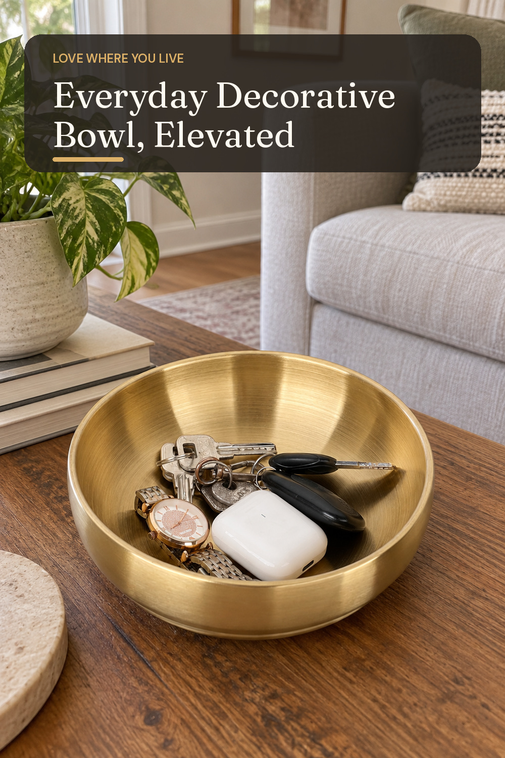 A decorative bowl used in a comfortable lived-in living room with natural window light and practical everyday styling.