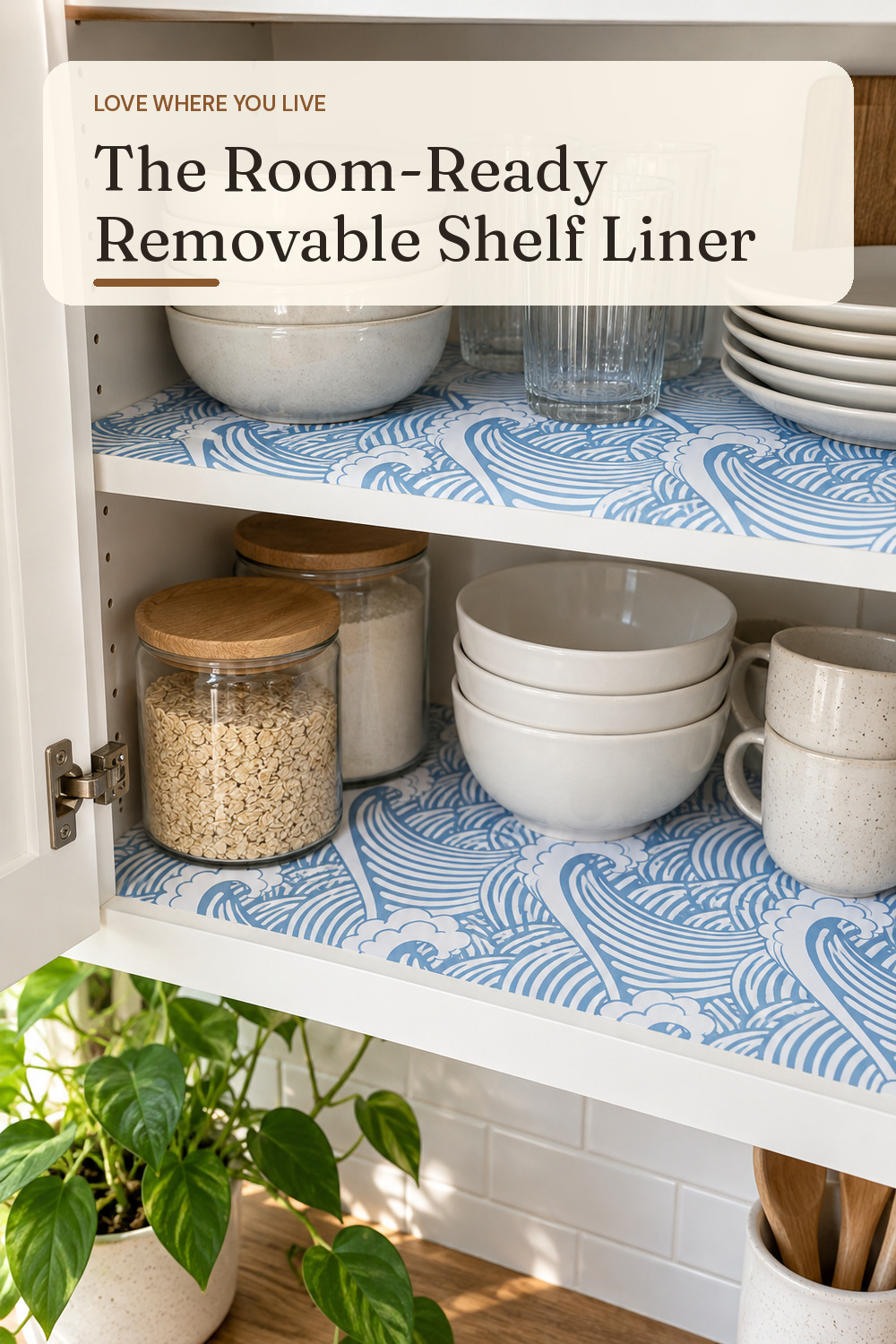 A removable shelf liner used in a lived-in rental kitchen cabinet with natural window light and practical everyday styling.