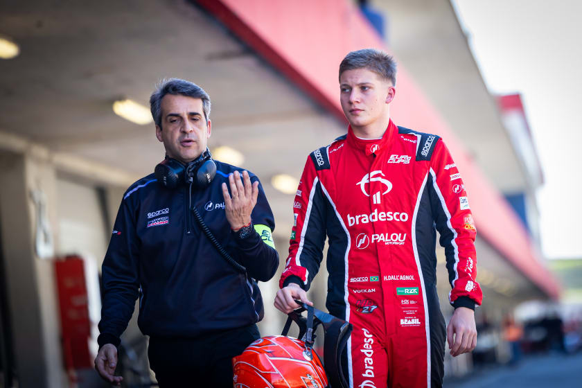 Walking back down the pit lane after a session, helmet in hand