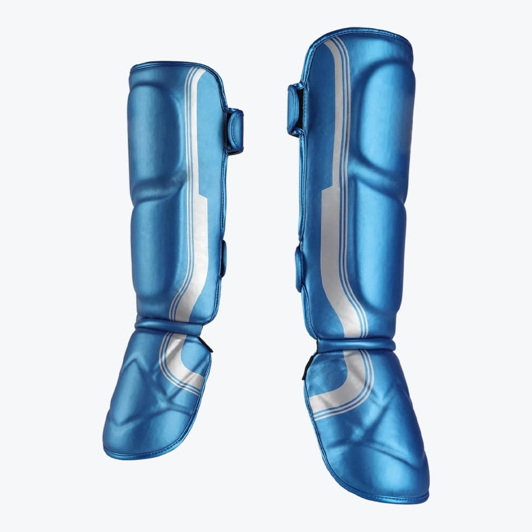 Blue Metallic Martial Arts Shin and Instep Guards A pair of metallic blue shin and instep guards with silver stripes, isolated on a white background.