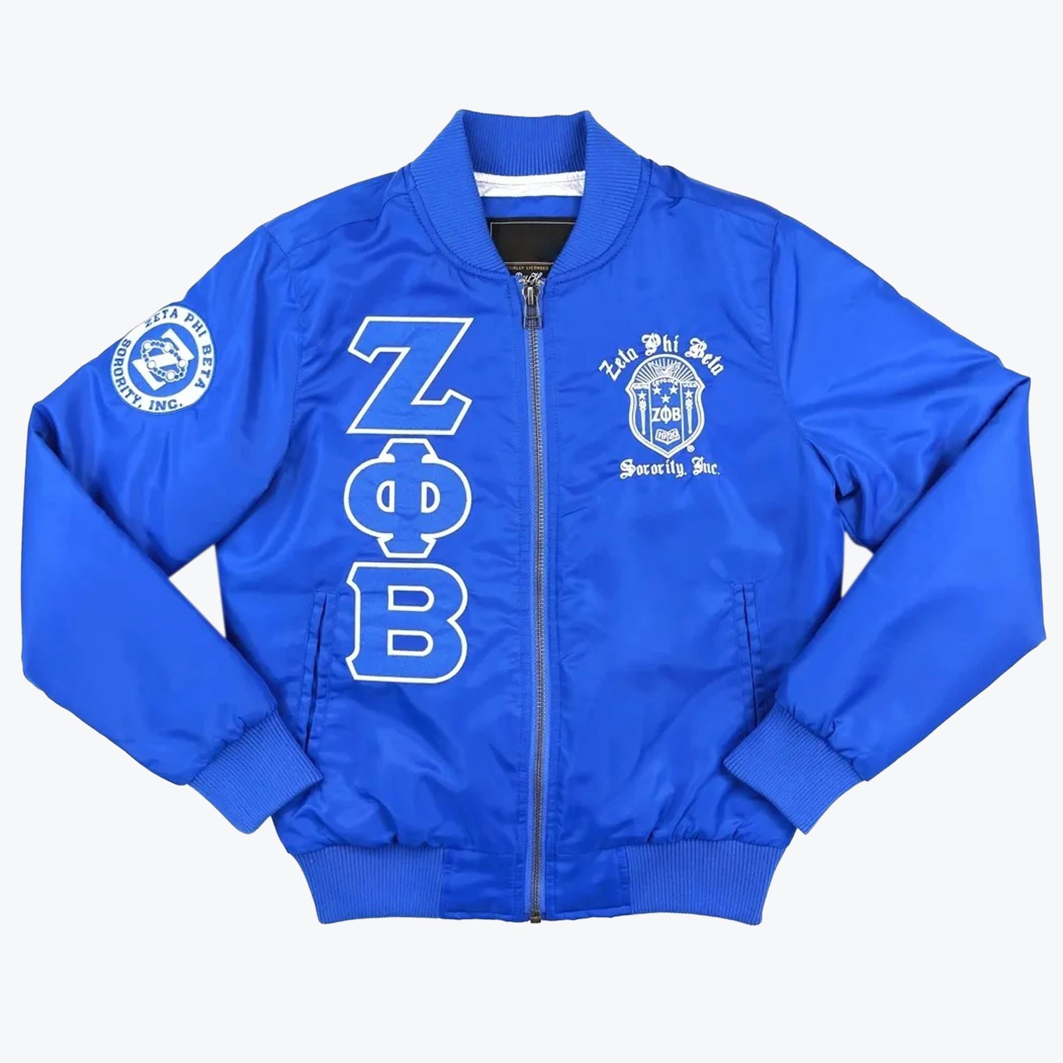 Zeta Phi Beta Sorority Royal Blue Bomber Jacket A royal blue bomber jacket with white Zeta Phi Beta Greek letters, crest, and sleeve patch.