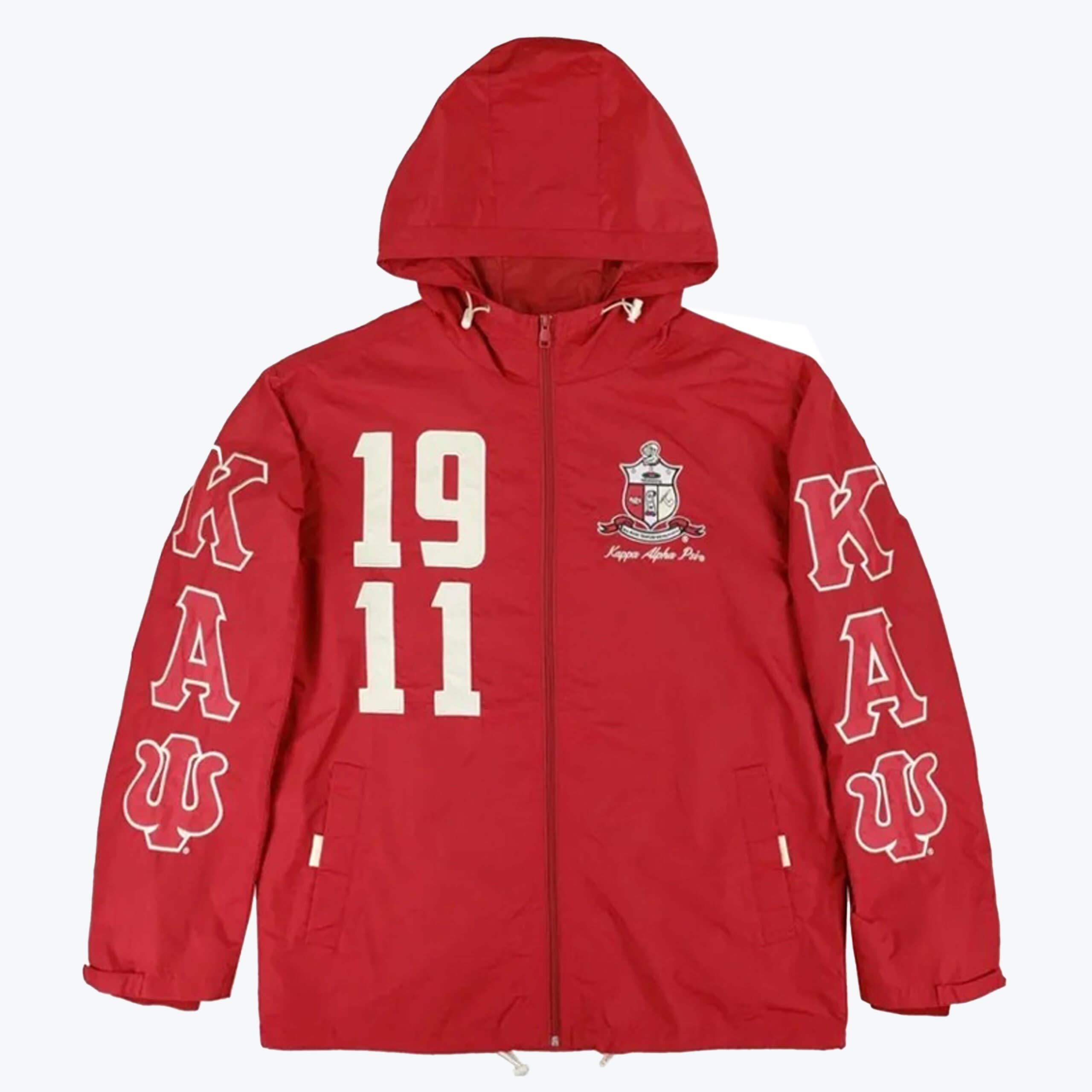 Kappa Alpha Psi Red Windbreaker Jacket A red hooded windbreaker jacket with Kappa Alpha Psi fraternity branding, featuring on the chest and the Greek letters Kappa, Alpha, Psi on the sleeves.