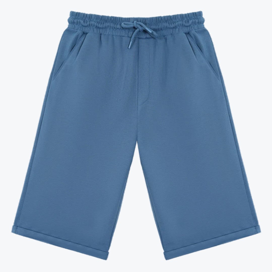 Blue Drawstring Sweat Shorts A pair of dusty blue wide-leg sweat shorts with an elastic drawstring waistband and side pockets, displayed against a plain white background.