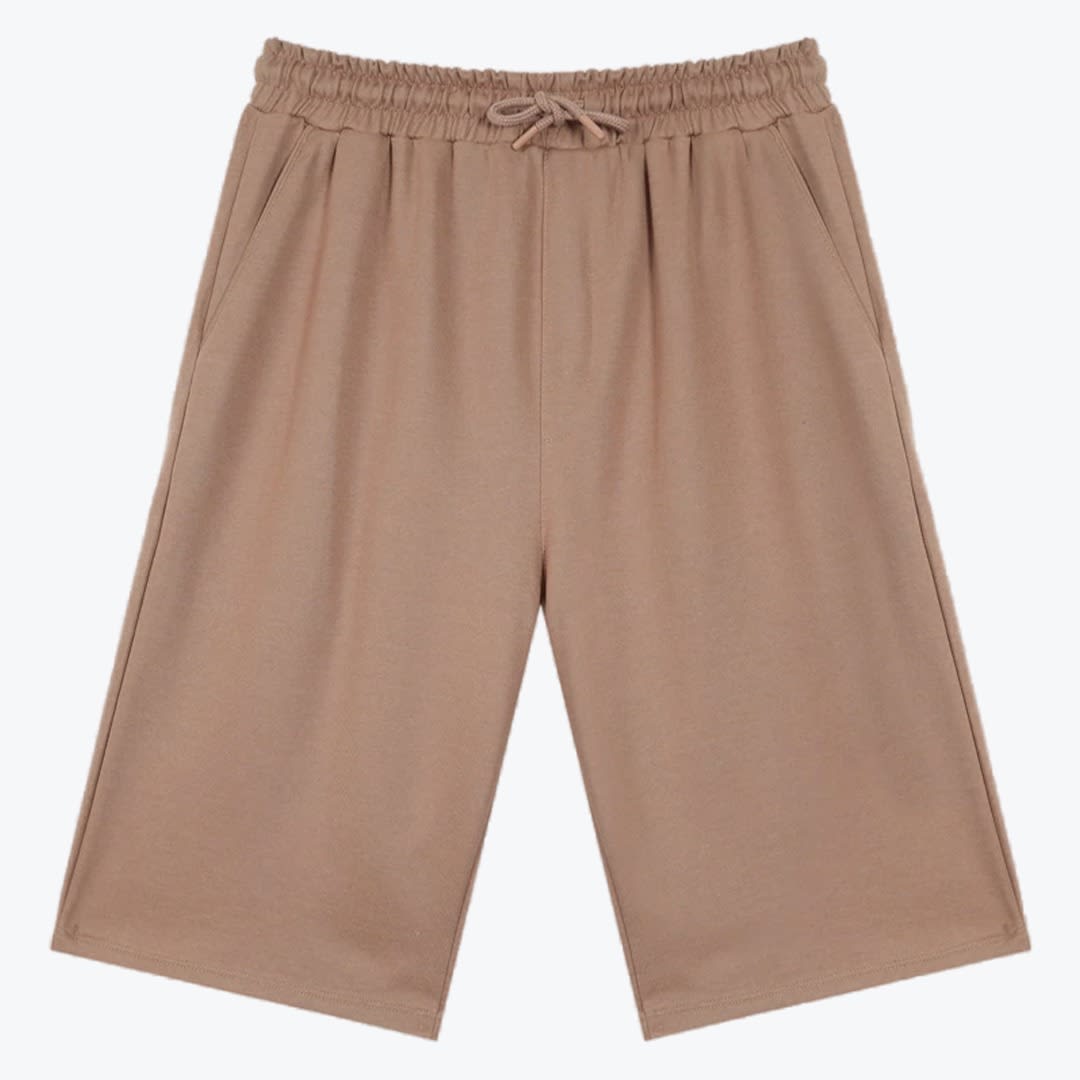Light Brown Wide-Leg Drawstring Shorts A pair of light brown, wide-leg casual shorts with an elastic drawstring waistband and side pockets, displayed flat against a plain white background.