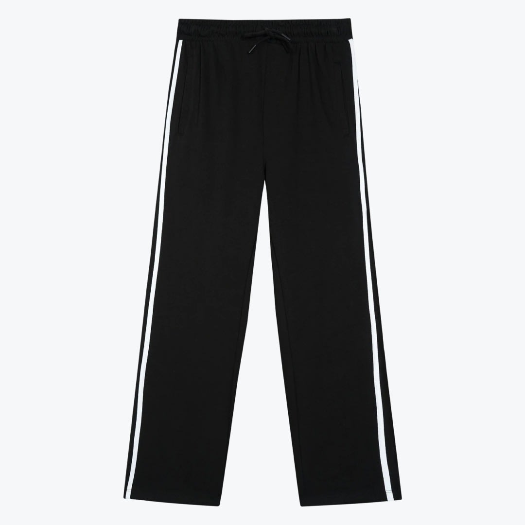 Black Track Pants with White Side Stripes A pair of black straight-leg track pants with a white stripe down each side and a drawstring waistband, displayed against a white background.