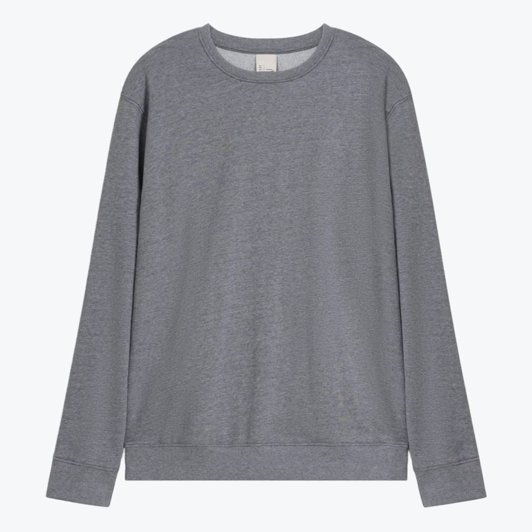 Grey Crewneck Sweatshirt A plain heather grey crewneck sweatshirt laid flat against a solid white background.
