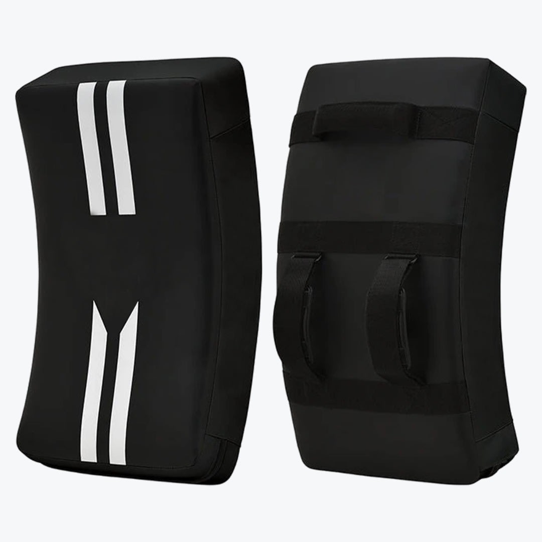 Black Curved Martial Arts Kicking Shield Pair Front and back view of a pair of black curved martial arts kicking shields with white stripes on the front and adjustable straps on the back.