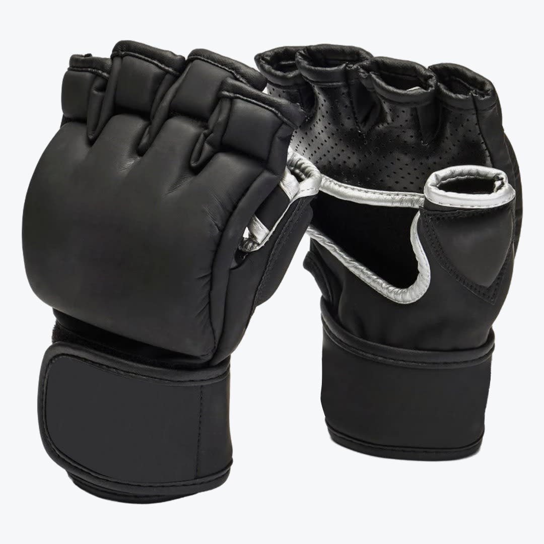 Black MMA Grappling Gloves A pair of black MMA grappling gloves, one showing the padded knuckle side and the other showing the open palm side with silver trim, set against a white background.