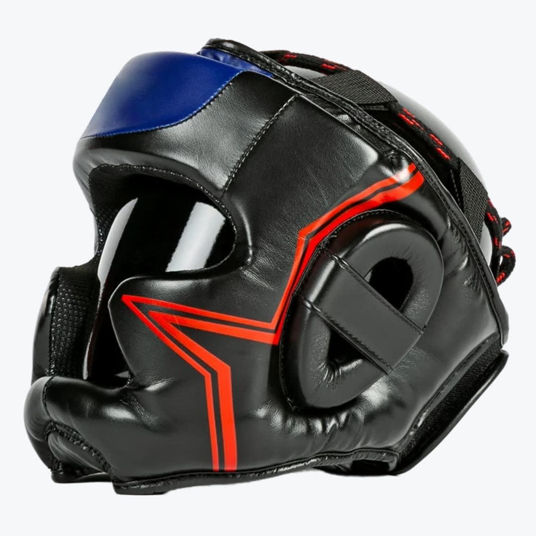 Black Boxing Headgear with Red and Blue Accents A side-angle view of a black leather boxing headgear with red geometric stripe accents and a blue forehead panel, shown on a white background.