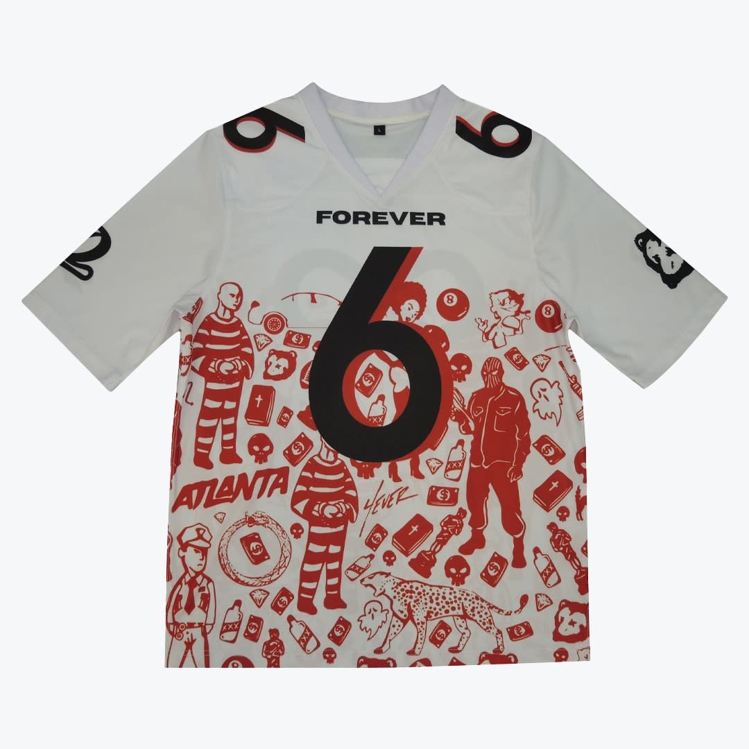 White Jersey with Red and Black Graphic Prints A white jersey with a large black number 6 on the chest, the word FOREVER above it, and a busy red doodle pattern on the lower half featuring prisoners, skulls, and the word ATLANTA.