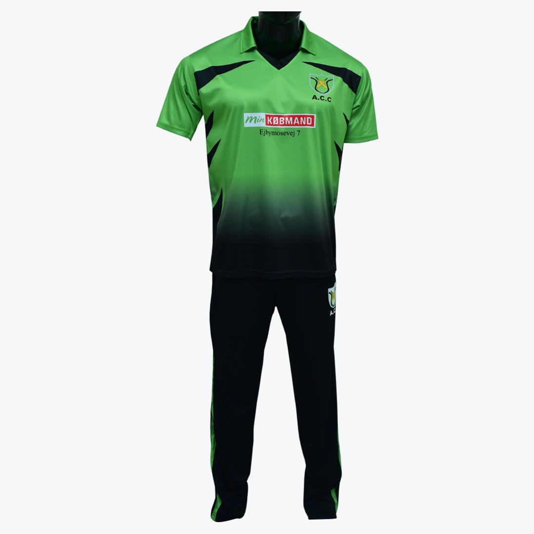 A green and black sports uniform on a mannequin, featuring a gradient jersey with sponsor logos and matching black track pants.