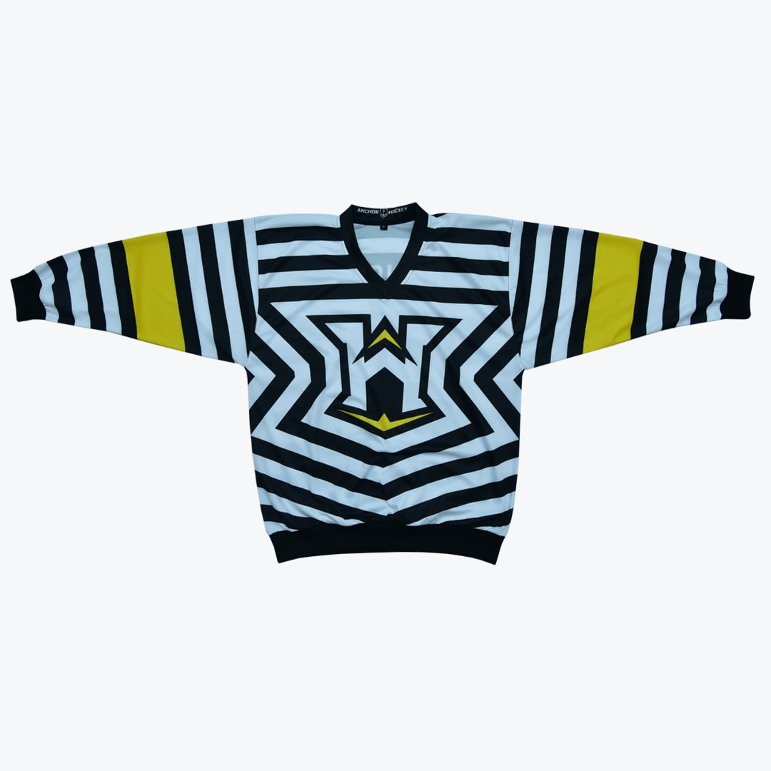 Anchor Hockey Striped Jersey A flat lay of a black, white, and yellow striped hockey jersey with a geometric logo on the chest, set against a plain white background.