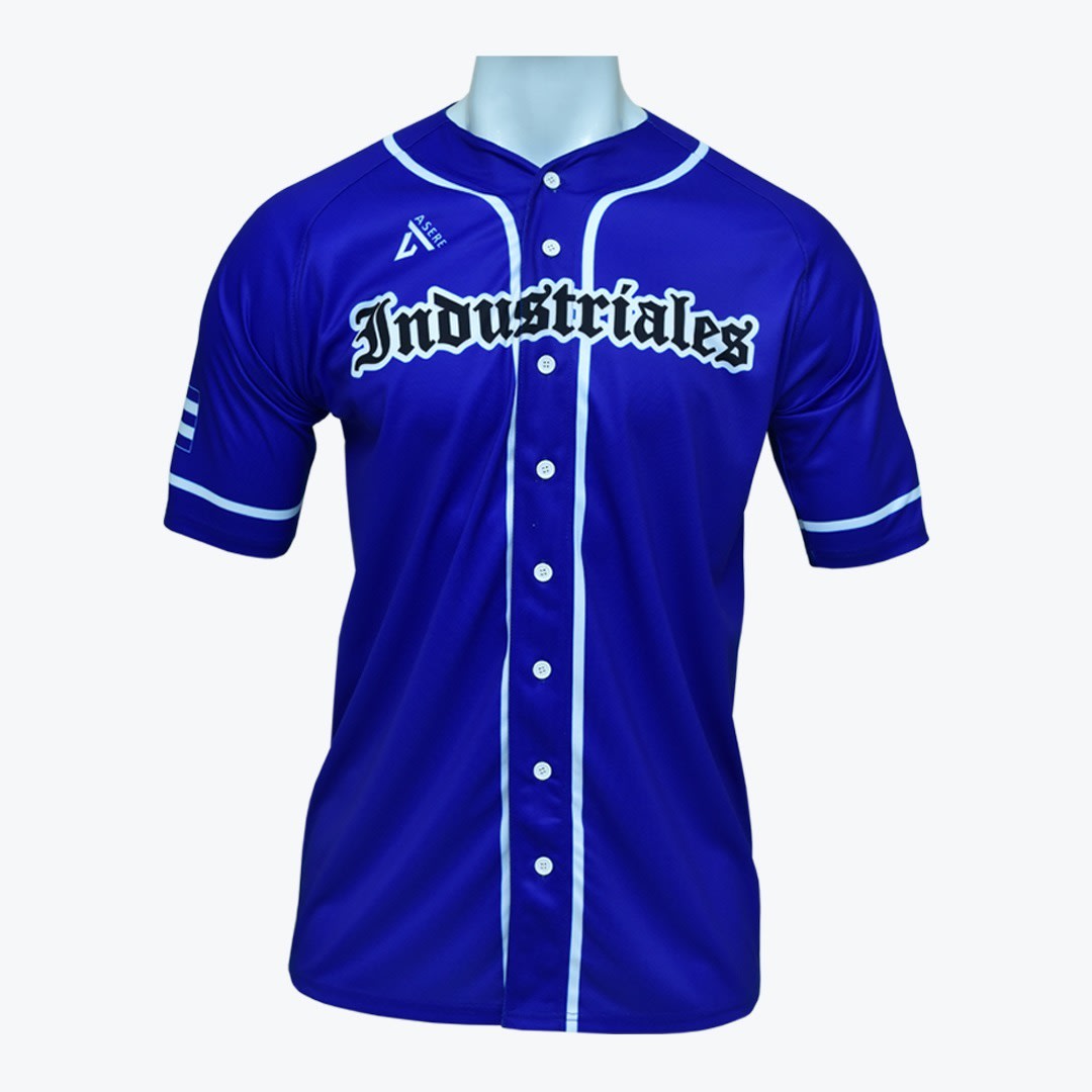 Blue Industriales Baseball Jersey A royal blue baseball jersey with white trim and buttons, featuring Industriales written across the chest in a stylized gothic font, displayed on a mannequin.