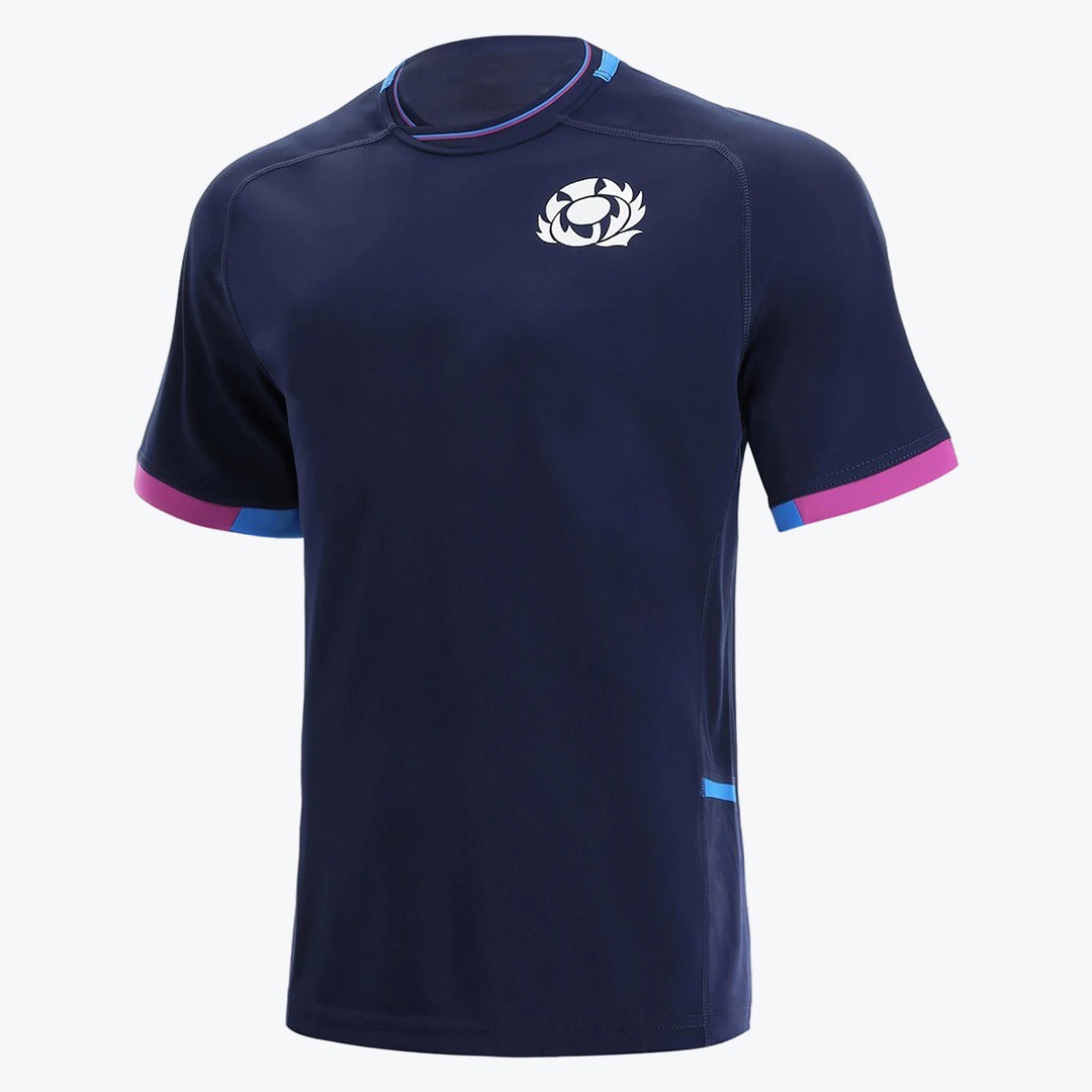 Scotland Rugby Navy Training T-Shirt A navy blue Scotland Rugby training t-shirt with a white thistle logo on the chest and pink and blue sleeve trim, displayed against a white background.