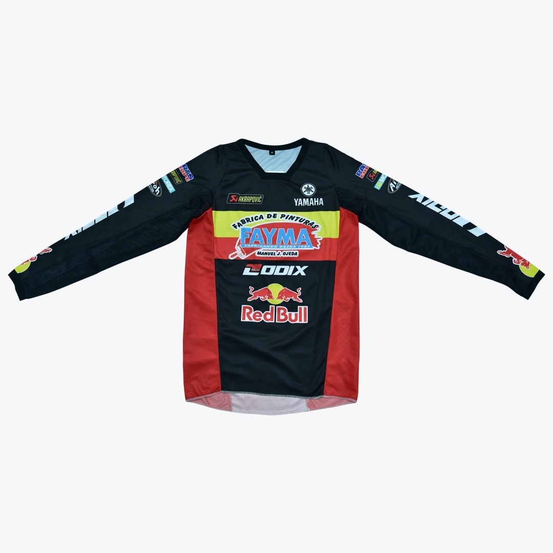 Red Bull and Yamaha Motocross Jersey A black, red, and yellow long-sleeved motocross jersey featuring prominent sponsor logos like Red Bull and Yamaha.