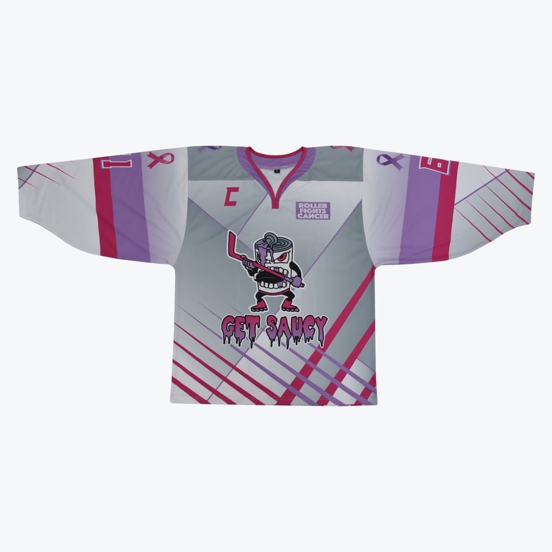 Roller Fights Cancer Get Saucy Hockey Jersey A grey, pink, and purple roller hockey jersey featuring a cartoon sauce can mascot holding a hockey stick, the text GET SAUCY, and a Roller Fights Cancer logo.
