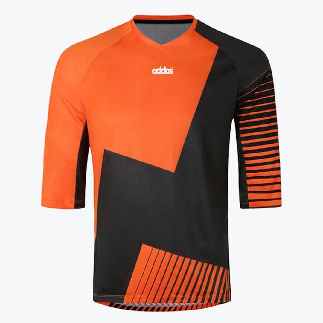 Orange and Black Three-Quarter Sleeve Athletic Jersey An orange and black athletic jersey with 3/4 sleeves, featuring an asymmetrical geometric pattern and a white logo on the chest.