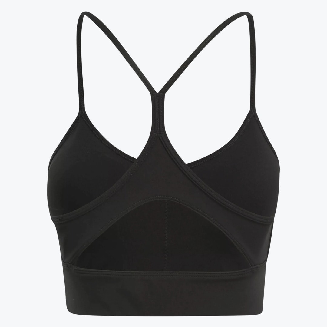 Back view of a black sports bra with thin straps and a triangular cutout on the back.