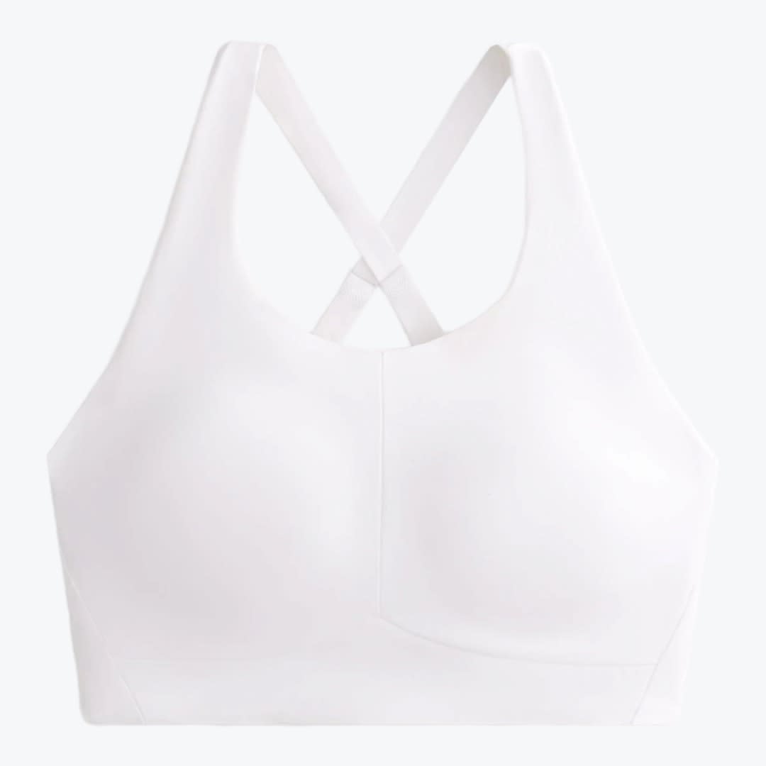 White Cross-Back Sports Bra A front-facing studio shot of a solid white sports bra with molded cups and crossed back straps, isolated on a light background.