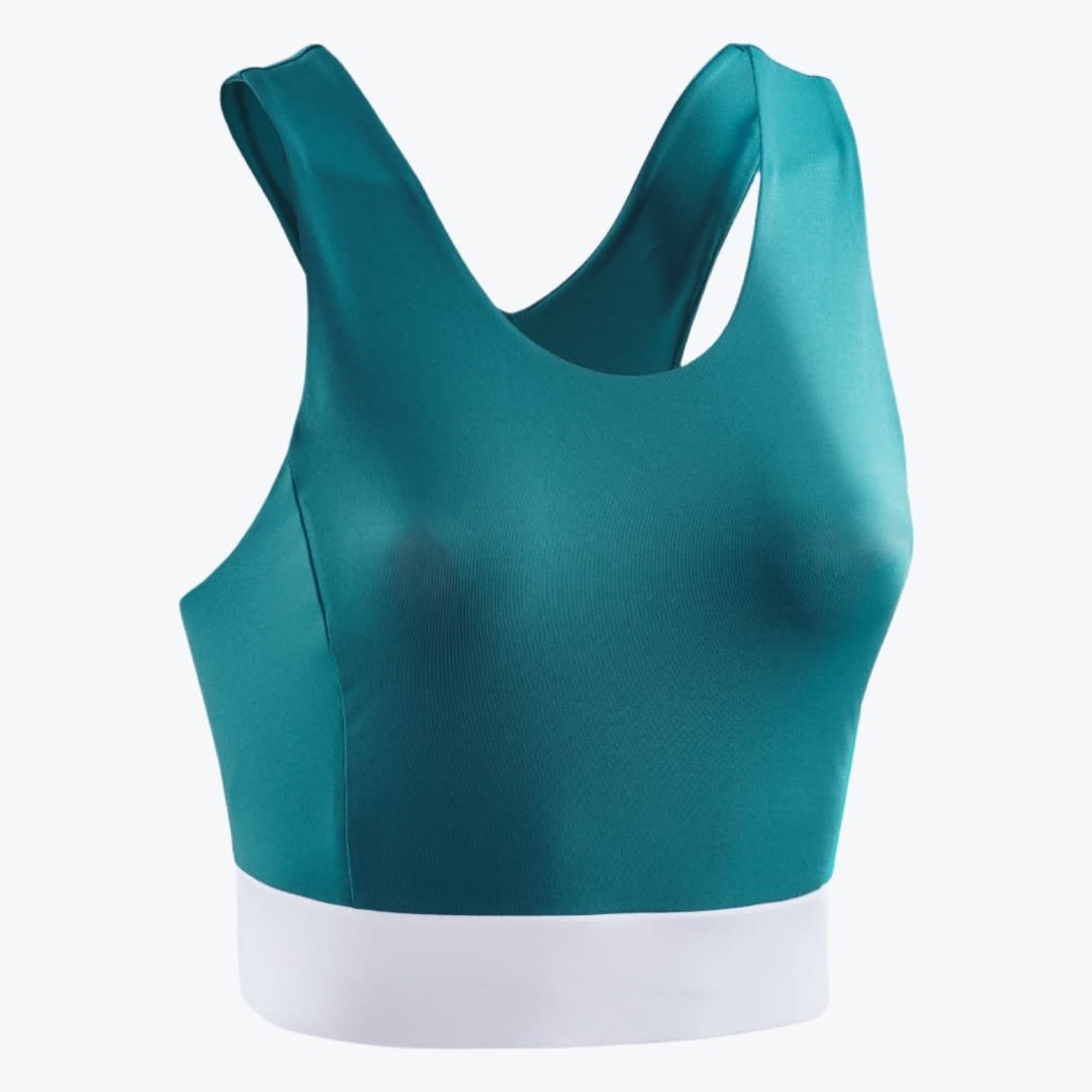 Teal Sports Bra with White Band A teal green sports bra with a thick white elastic band at the bottom, shown against a plain white background.