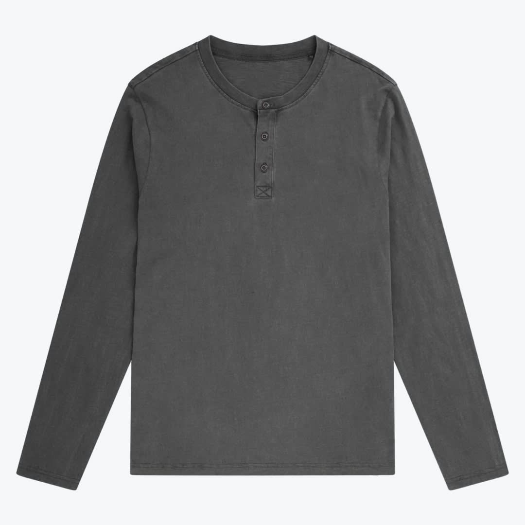 Men charcoal grey long-sleeve Henley shirt. A flat lay photo of a charcoal grey long-sleeve henley shirt with a three-button placket on a white background.