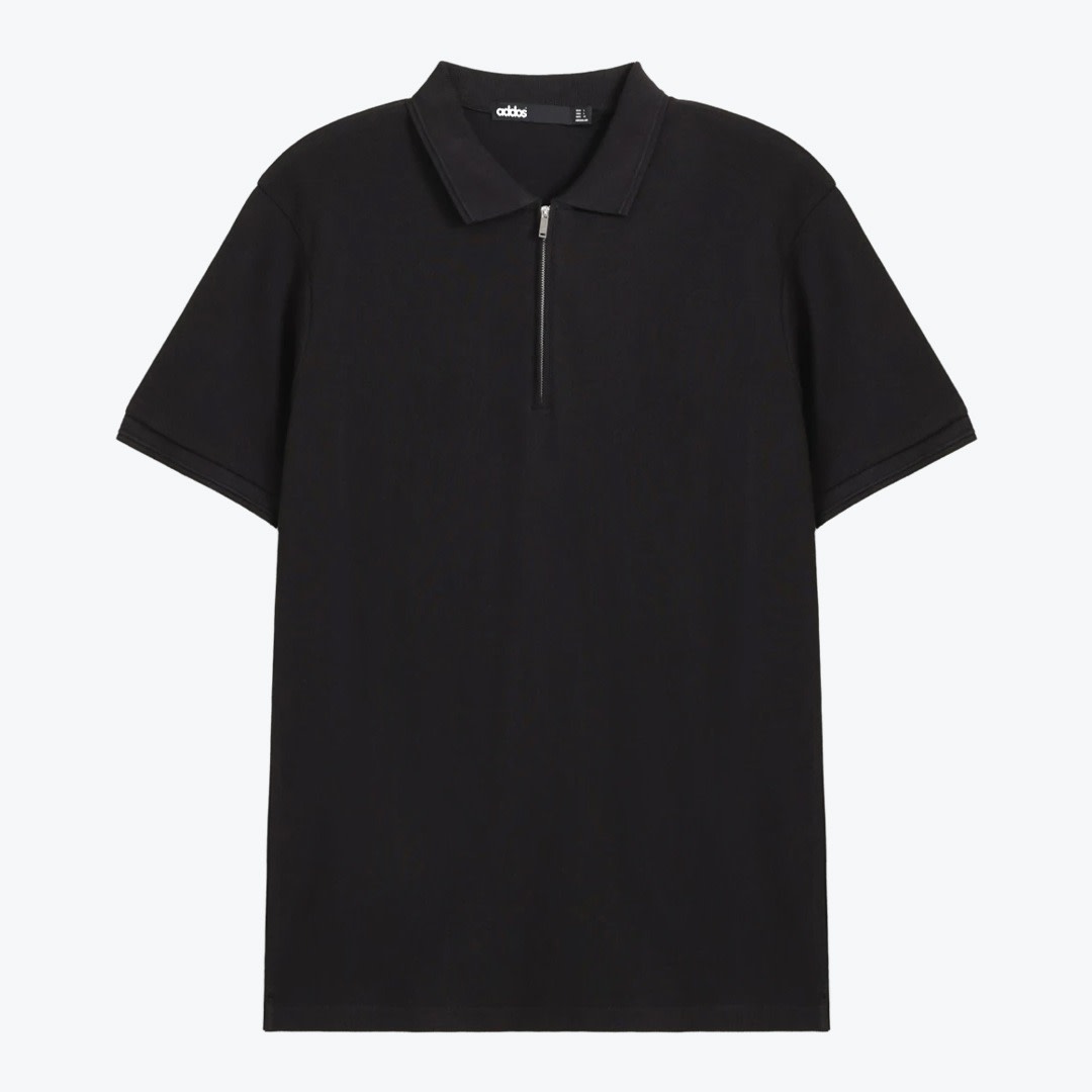 Men black half-zip polo shirt. A flat lay of a black short-sleeved polo shirt with a silver half-zip collar on a white background.