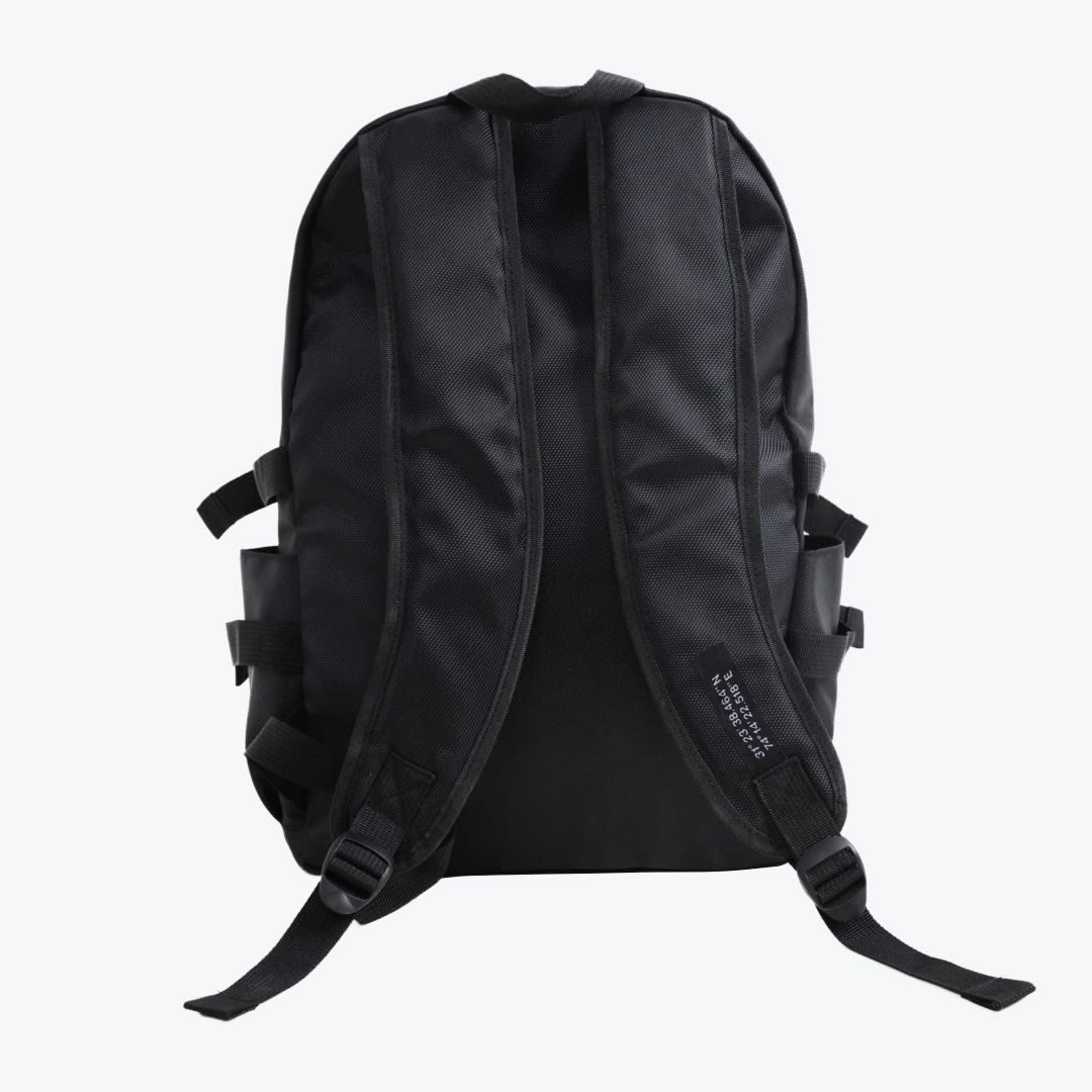 Rear view of a black backpack with padded shoulder straps, mesh back, and side compression straps against a white background.