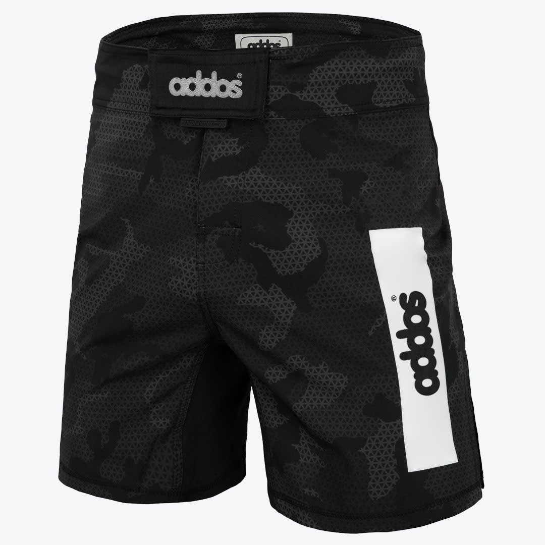 Addos Camouflage MMA Training Shorts A front view of black and grey camouflage Addos MMA training shorts featuring a white vertical logo stripe on the left leg and a velcro waistband.