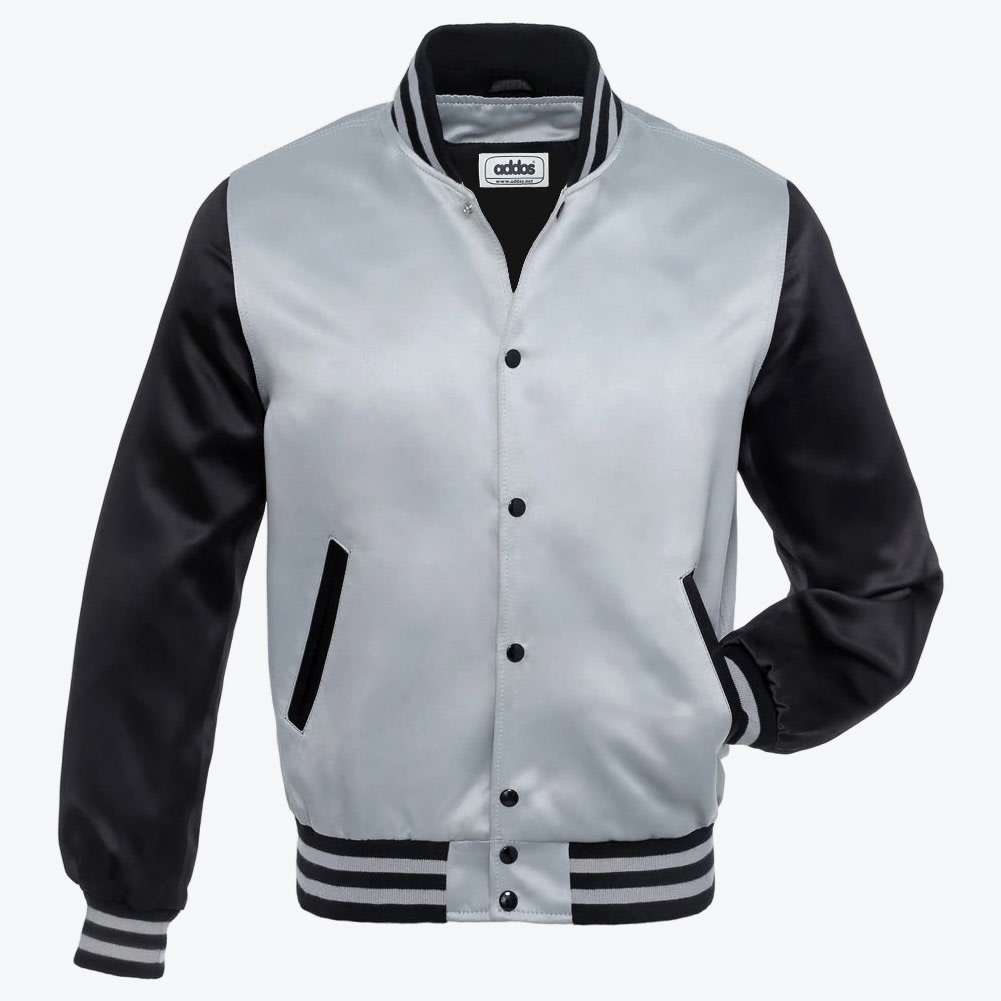 A silver and black satin varsity jacket with snap buttons and striped ribbed trim, displayed against a white background.